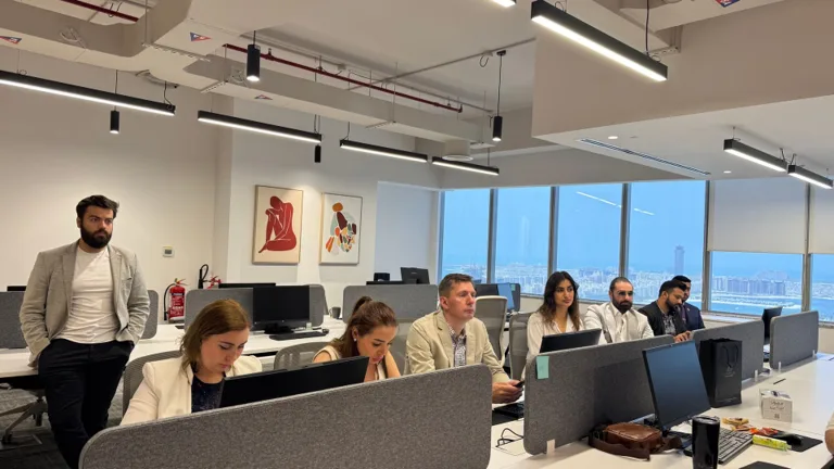 Marketing and commercial leaders reviewing priorities together in a modern office