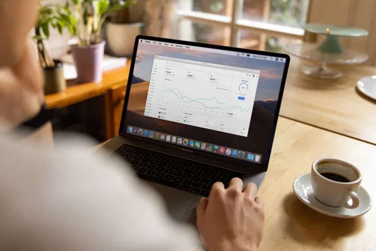 Commercial AI briefing dashboard viewed on a laptop for market and visibility analysis
