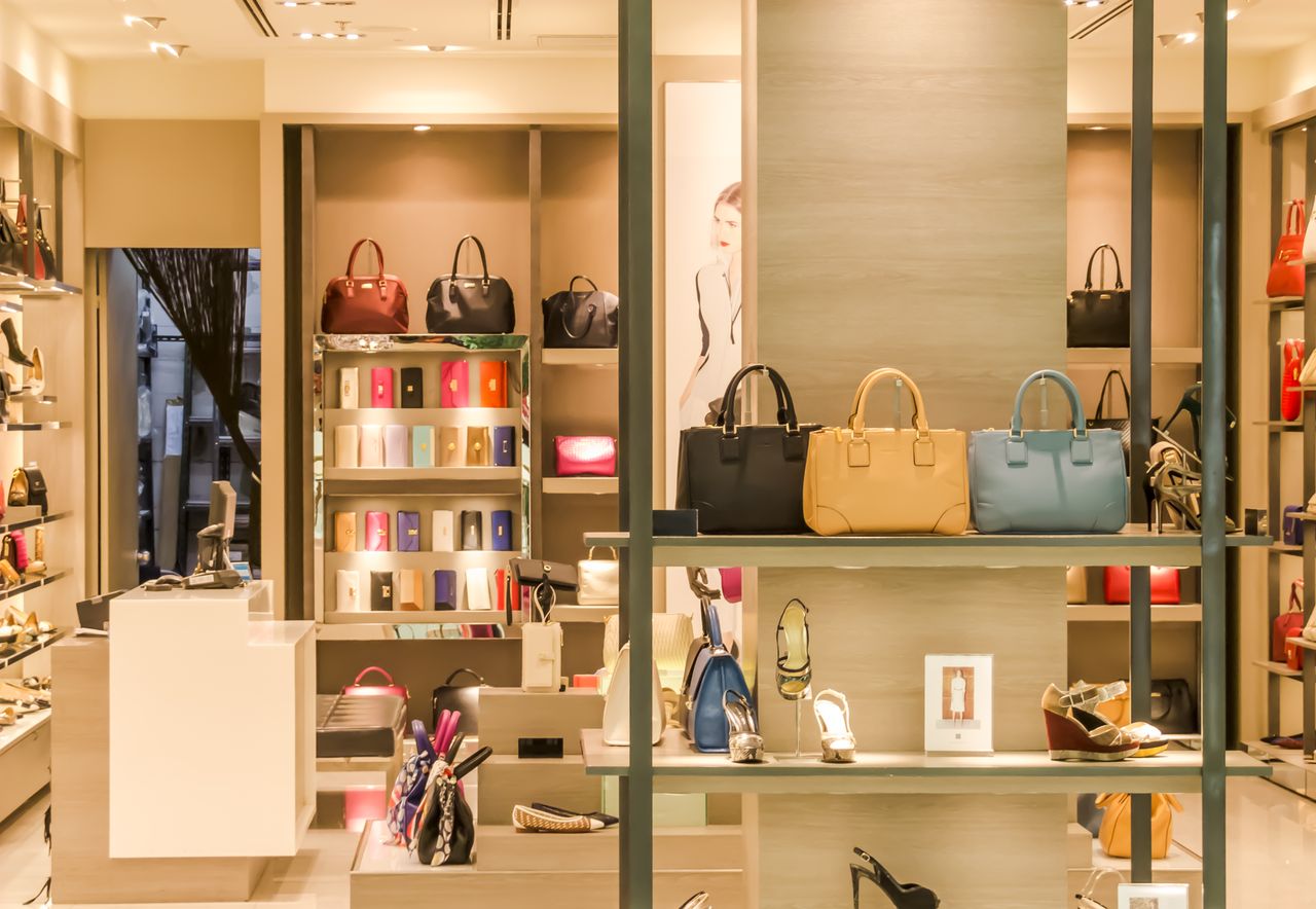 Luxury boutique interior with handbags and accessories