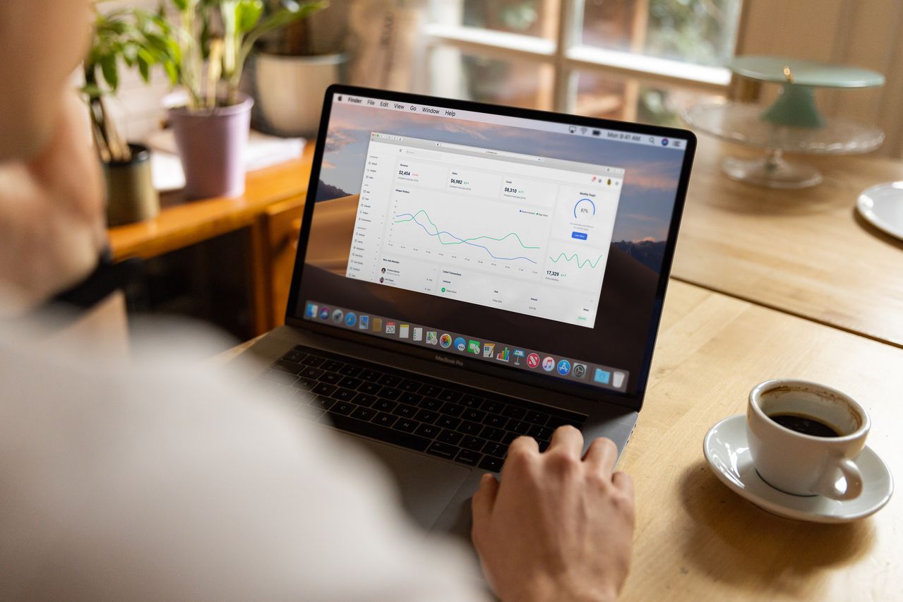 Commercial AI briefing dashboard viewed on a laptop for market and visibility analysis