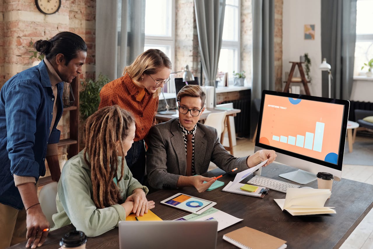 Commercial team reviewing visibility and reporting metrics on a dashboard