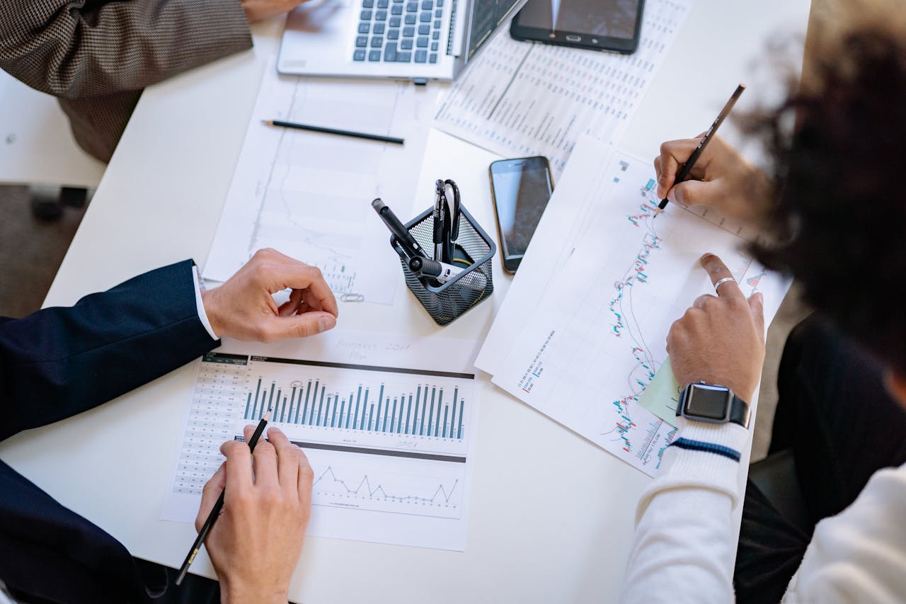 Commercial planning table with charts and go-to-market priorities under review
